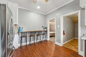 Kitchen featuring ceiling fan, stainless steel appliances, hardwood / wood-style flooring