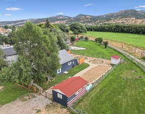 Birds eye view of property featuring a mountain view and a rural view