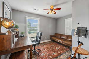 Office or Bedroom area featuring hardwood / wood-style flooring and ceiling fan