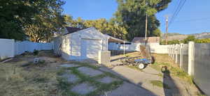 Exterior space with a mountain view and a garage