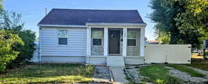 View of front of property with a front lawn