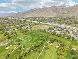Aerial view with a residential view, a mountain view, and golf course view