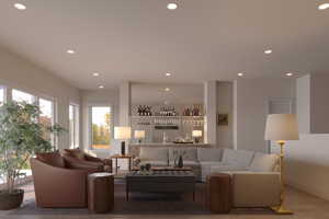 Living room featuring light hardwood / wood-style floors and indoor bar