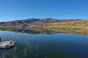 View of water feature with a mountain view