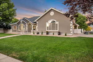 View of front of property featuring a lawn