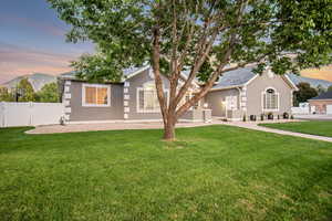 View of front of house featuring a lawn