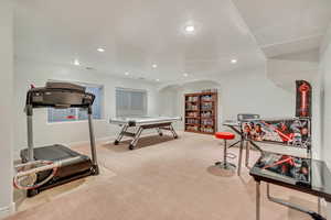 Workout area with light colored carpet