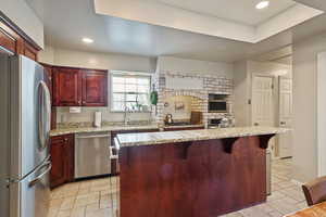 Impressive brick work surrounding cooktop and oven.