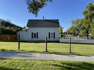 Exterior space featuring a front lawn