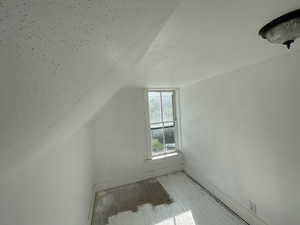 Bonus room featuring lofted ceiling