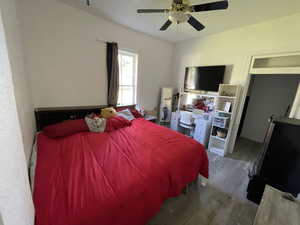 Bedroom featuring hardwood / wood-style floors and ceiling fan