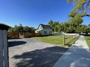 View of side of property with a lawn