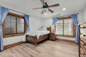 Bedroom featuring ceiling fan and light wood-type flooring