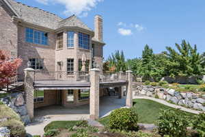 Back of property with a balcony