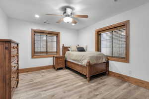 Bedroom featuring ceiling fan and light wood-type flooring