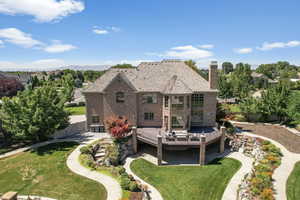 Rear view of property featuring a yard