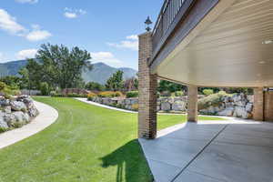 View of yard with a mountain view and a patio