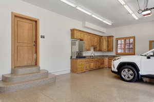 Garage with a garage door opener and sink