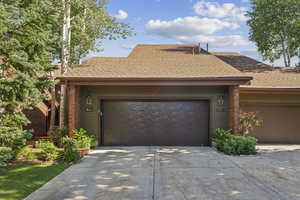 View of front of property featuring a garage