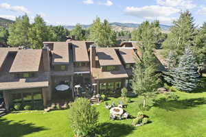 Birds eye view of property with a mountain view