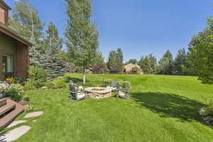 View of yard featuring an outdoor fire pit