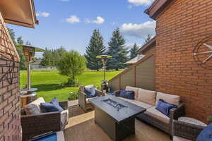 View of patio / terrace featuring an outdoor living space with a fire pit