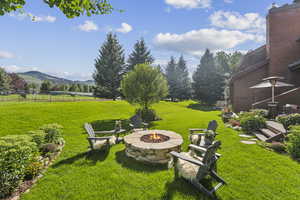 View of yard with a fire pit and a mountain view