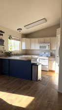 Updated flooring goes up to the island/entrance of kitchen. Tile included to finish kitchen.