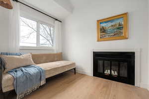 Sitting room with wood-type flooring