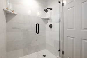 Bathroom with a shower with shower door