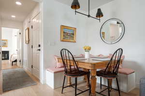 Dining area with light wood-type flooring