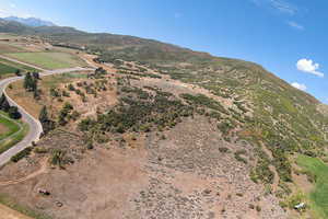 Property view of mountains with a rural view