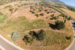 Birds eye view of property featuring a mountain view and a rural view