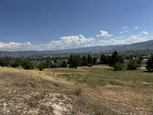 Property view of mountains with a rural view