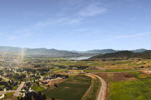 Property view of mountains with a water view