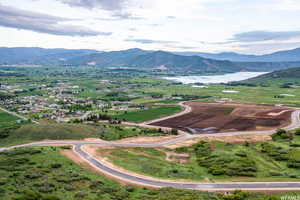 Aerial view featuring a water and mountain view