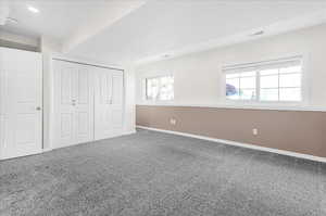 Unfurnished bedroom with a closet and carpet