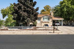 View of front of home with a carport