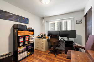 Office area featuring dark hardwood / wood-style floors