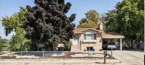 View of front of property featuring a carport