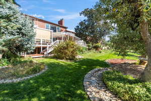 View of yard featuring a wooden deck