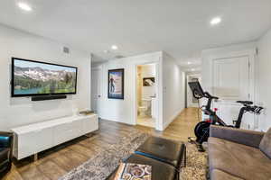 Living room with hardwood / wood-style flooring