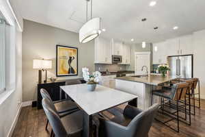 Interior space with dark hardwood / wood-style flooring and sink