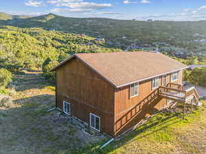 Birds eye view of property with a mountain view