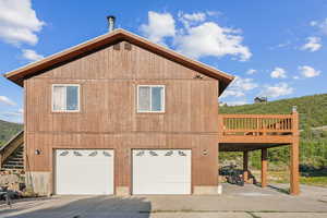 View of property exterior featuring a garage