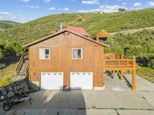 Exterior space with a mountain view and a garage