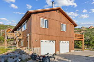 View of property exterior featuring a garage