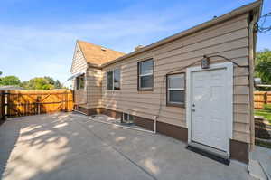 Back of house with a patio