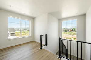 Upstairs Landing featuring light wood-type flooring. 2411 S.