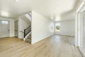 Additional living space with light wood-type flooring. 2411 S.